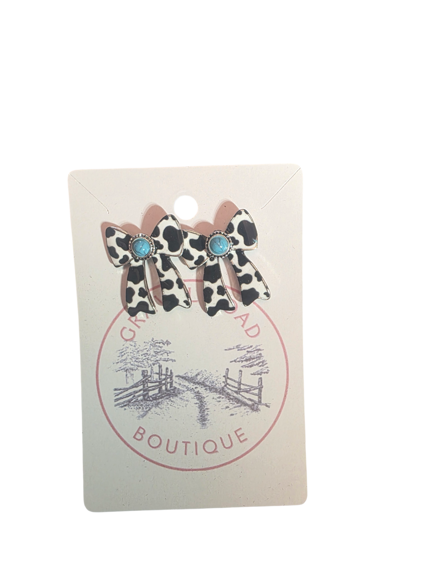 COW PRINT BOW EARRINGS